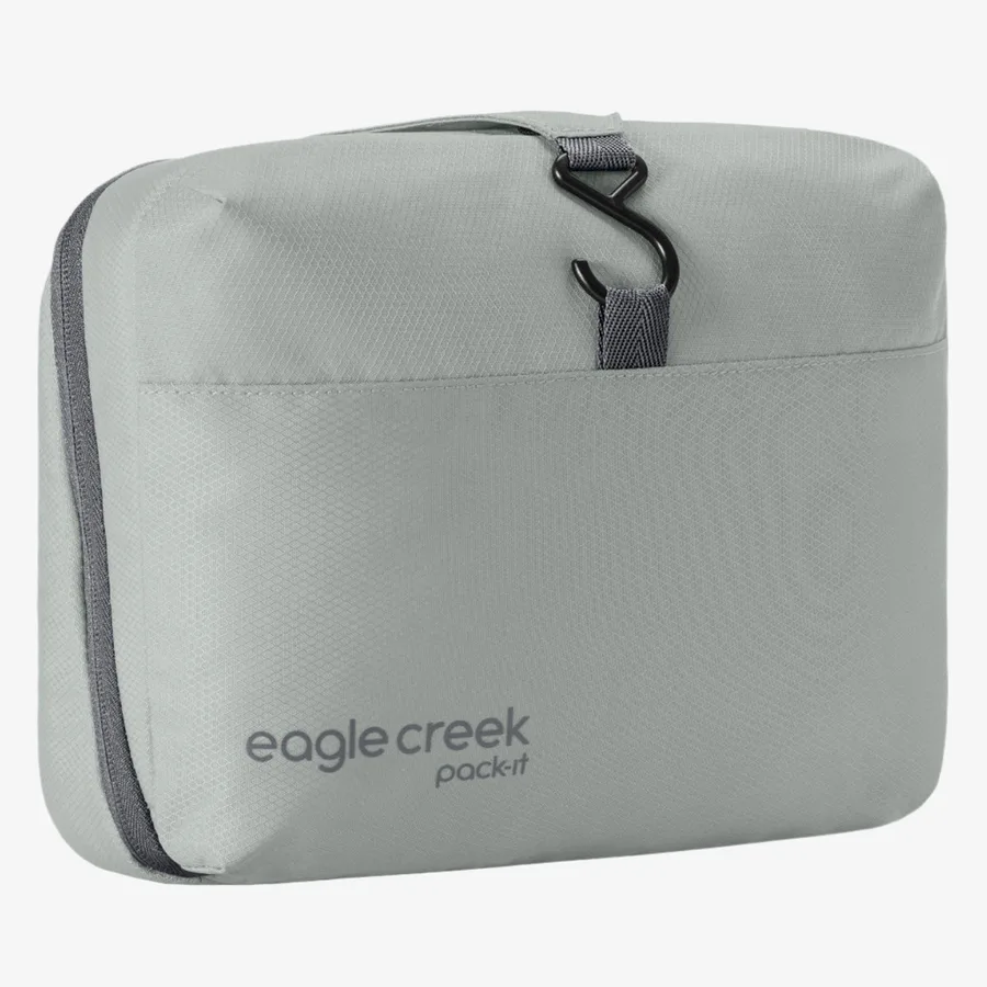 The Eagle Creek Pack-It Hanging Toiletry Bag in grey with its black metal hanging hook showing at the top