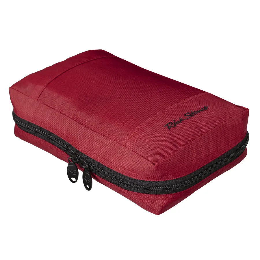 The Rick Steves Classic Travel Toiletry Kit in red, a soft zippered nylon kit shown closed